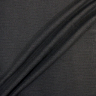 three diagonal lines draped of a grey rib knit jersey