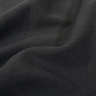 close-up of a grey rib knit jersey fabric, detailing the surface shine