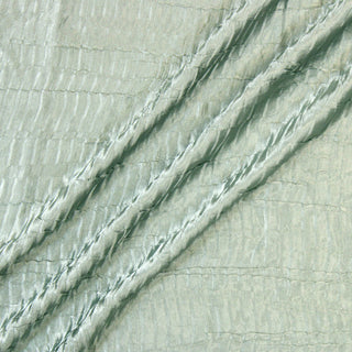 Three lines draped of a satin plisse fabric.