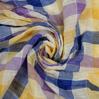 Swirl of a seersucker plaid fabric, detailing the surface shine and drape.