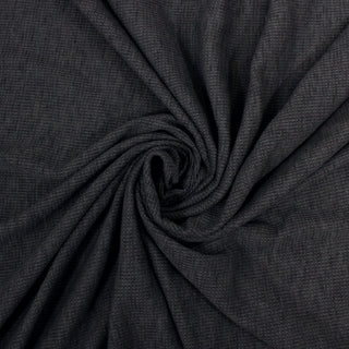 swirl of a slate blue waffle knit jersey fabric