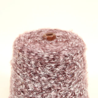 Closeup of sour cherry loop yarn on a white background.