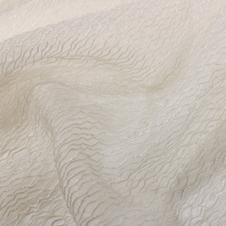 close-up of a novelty sparkly organza fabric, detailing the surface shine
