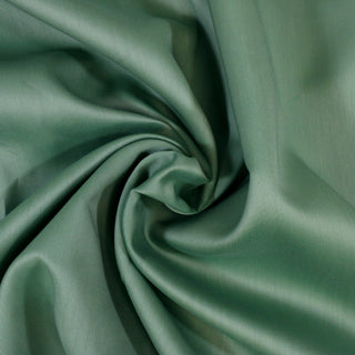 swirl of a spearmint bengaline fabric, detailing the surface shine and drape.