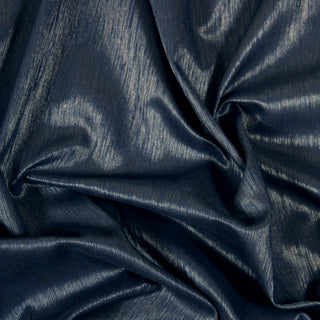 Close up of a navy and silver upholstery fabric, detailing the surface shine.