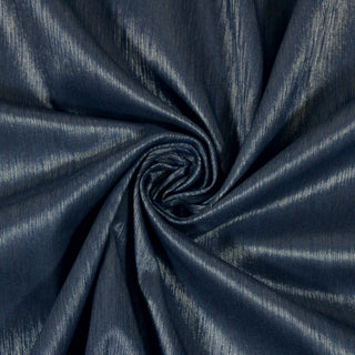 Swirl of a navy and silver upholstery fabric, detailing the surface shine and drape.