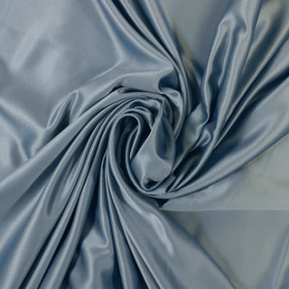 Swirl of a blue polyester satin fabric, detailing the drape and surface shine.