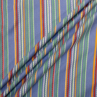 three diagonal lines draped of a multicolor stripe jersey fabric