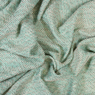 Close up of a teal tweed fabric, detailing the surface shine.