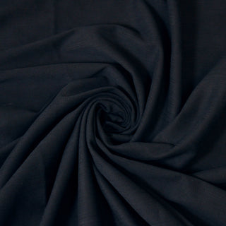 Swirl of a navy twill fabric, detailing the surface shine and drape.
