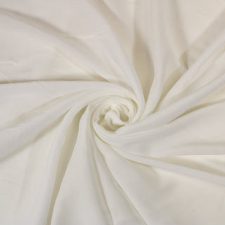 Swirl of a white voile, detailing the surface shine and drape.