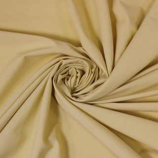 Swirl of a yellow broadcloth, detailing the surface shine and drape.