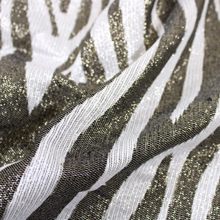 close-up of a lurex zebra jacquard fabric, detailing the surface shine
